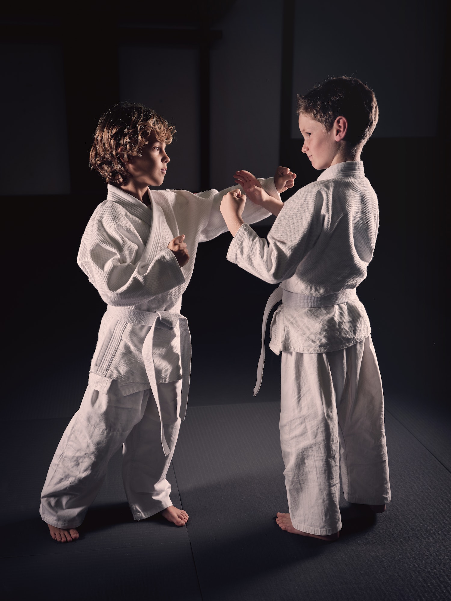 Boy practicing martial arts in gym